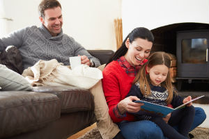 Happy family enjoying heat during the winter